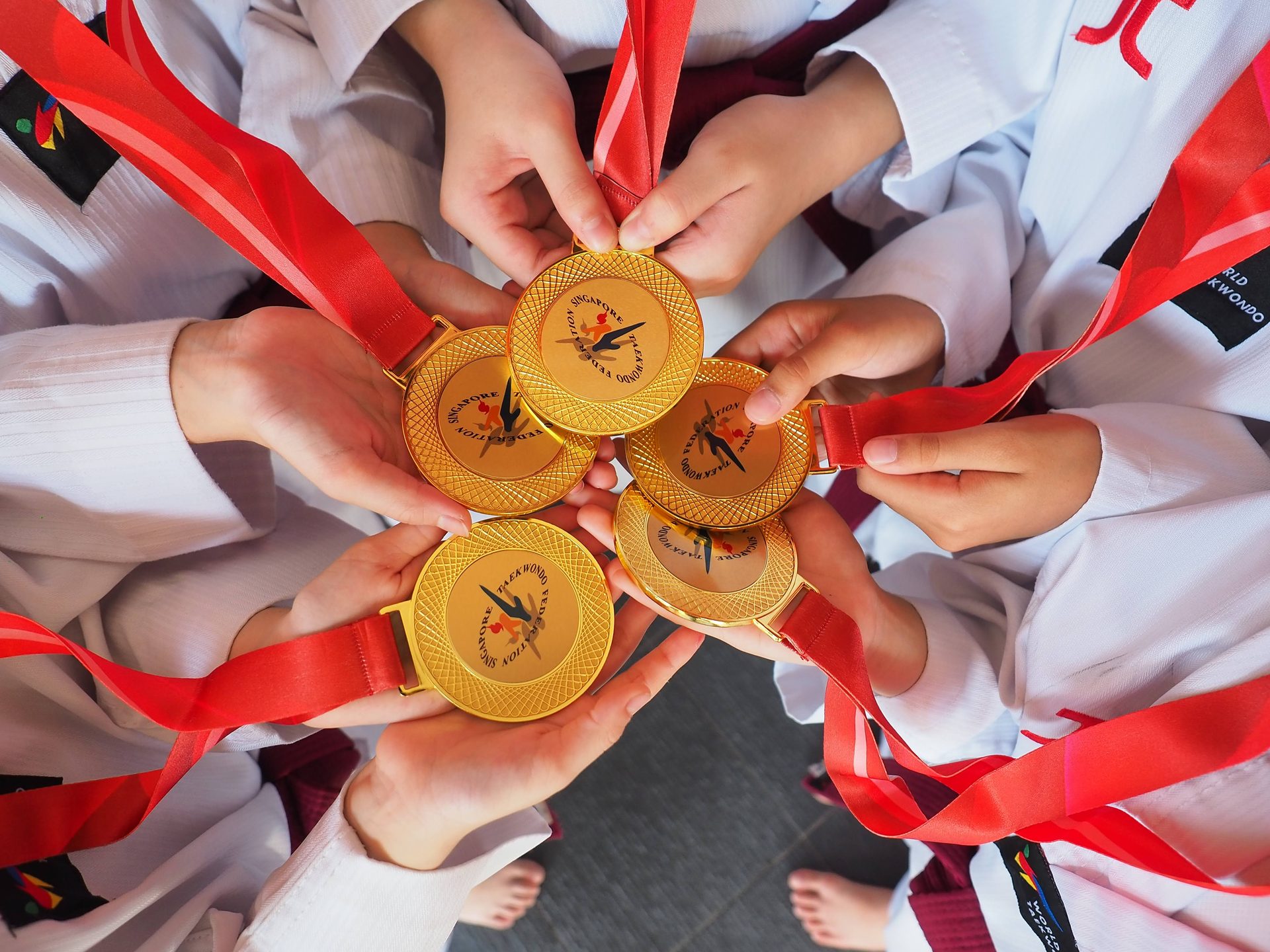 Raiders students holding gold medals