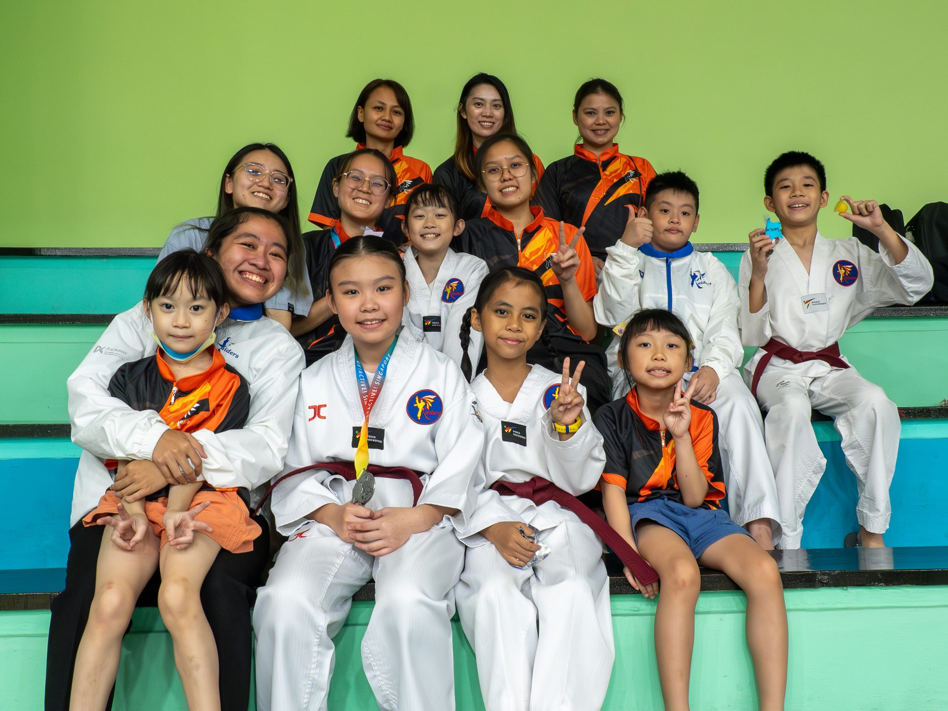 Raiders coaches and students at a competition