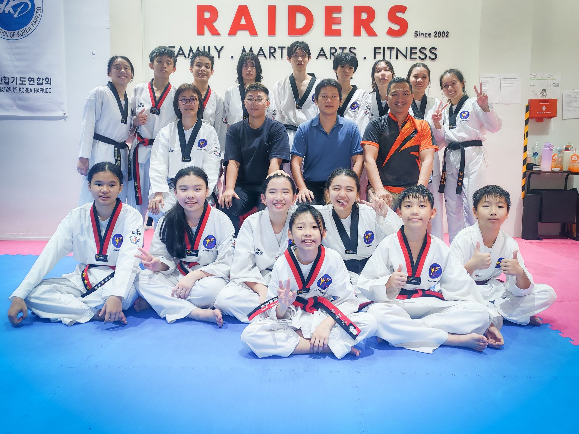 Raiders students and coaches in the studio